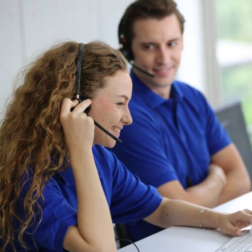 Smiling Woman In Headset Working In Call Center Office Smiling Woman In Headset Working In Call Center Office